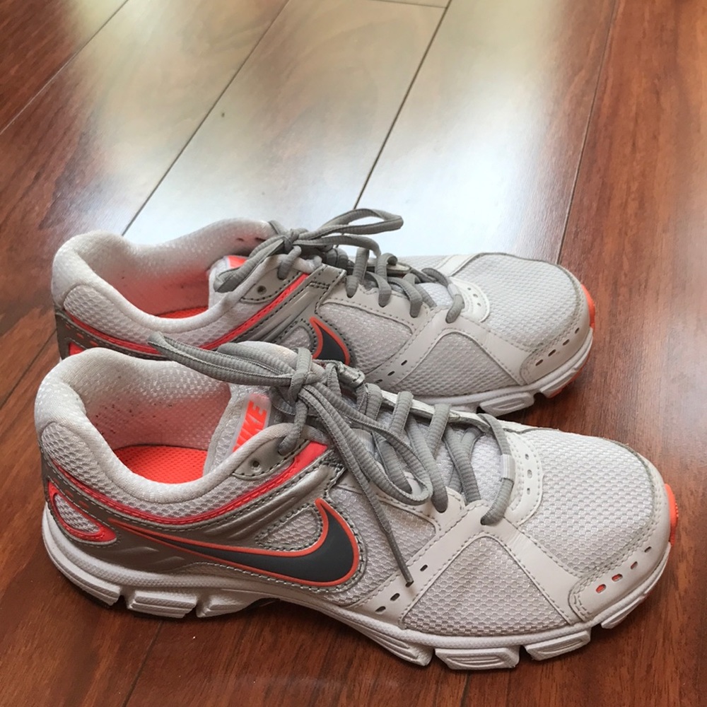 White and orange Nike sneakers